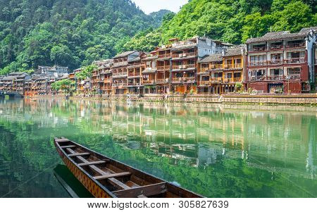 Scenic View Of Fenghuang Phoenix Ancient Town With Tuo Jiang River Boat And Old Houses In Hunan Chin