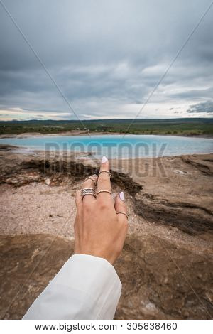 Woman Show The Blue Lake Near Mountains. Icland
