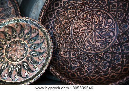 Copper Plate Handcrafted, Traditionally Made In Lagich, Azerbaijan. Handmade Plate In Souvenir Shop.