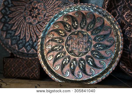 Copper Plate Handcrafted, Traditionally Made In Lagich, Azerbaijan. Handmade Plate In Souvenir Shop.