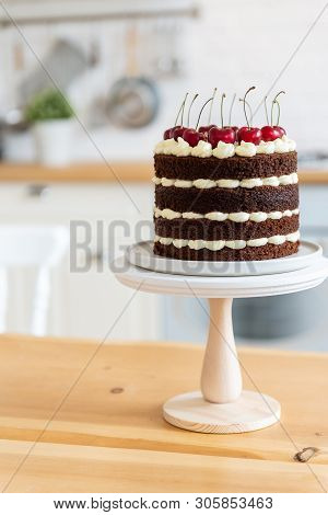 Summer Dessert With Cherries. Naked Chocolate Cake On The Kitchen Table. Holiday Concept. Happy Birt