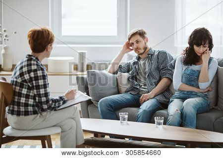 Young Married Couple During Telegraphy While Considering Divorce