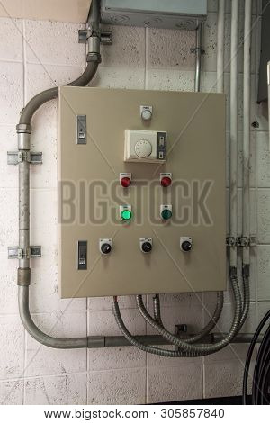 Metal Electricity Control Box With Sign On The Wall