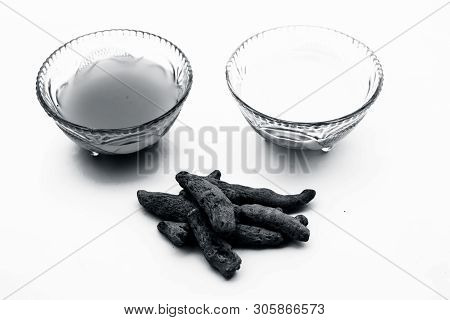 Turmeric & Raw Milk Face Pack Isolated On White In A Glass Bowl Along With Some Raw Milk And Turmeri