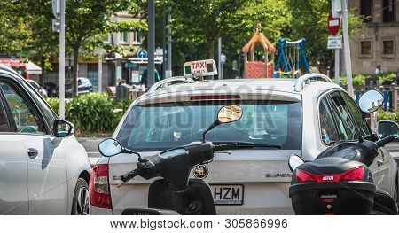 Motorcycle And Taxis Parking Near Town Hall In Irun, Spain