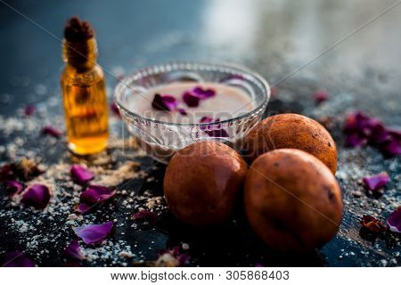 Perfect Remedy For Dry Feet On Wooden Surface I.e. Chikoo Pulp In A Bowl Well Mixed With Castor Oil