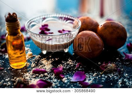Perfect Remedy For Dry Feet On Wooden Surface I.e. Chikoo Pulp In A Bowl Well Mixed With Castor Oil