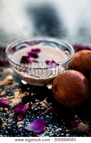 Perfect Remedy For Dry Feet On Wooden Surface I.e. Chikoo Pulp In A Bowl Well Mixed With Castor Oil