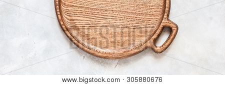 Empty Round Wooden Dish On Grey Concrete Background, Banner, Copy Space For Your Text