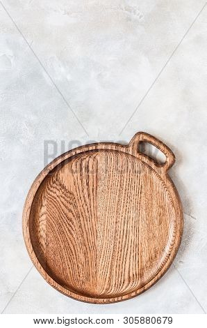 Empty Round Wooden Dish On Grey Concrete Background, Copy Space For Your Text