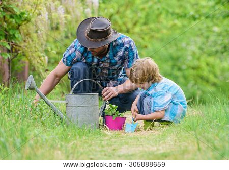 Make Planet Greener. Growing Plants. Take Care Of Plants. Day Of Earth. Boy And Father In Nature. Ga