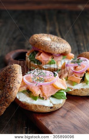 Lox - Everything Bagel With Smoked Salmon, Spinach, Red Onions, Avocado And Cream Cheese Over A Rust