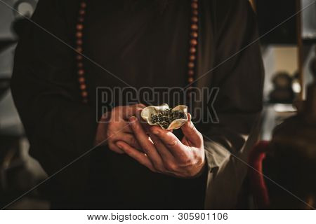 Tea master holding bowl with a tea