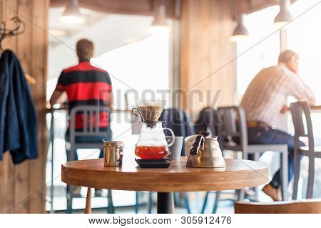 Closeup Of Coffee Brewing Gadgets On Wooden Table In Cafe. Drip Brewing, Filtered Coffee, Or Pour-ov