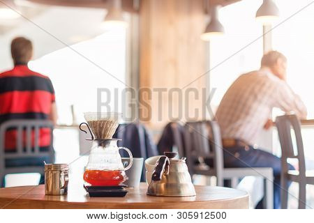 Closeup Of Coffee Brewing Gadgets On Wooden Table In Cafe. Drip Brewing, Filtered Coffee, Or Pour-ov