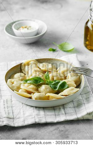 Meat Dumplings - Russian Pelmeni, Ravioli With Meat On A White Plate