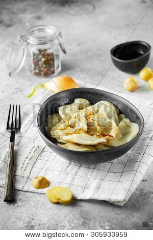 Dumplings, Filled With Mashed Potatoes And Onions. Russian, Ukrainian Or Polish Dish: Varenyky, Vare