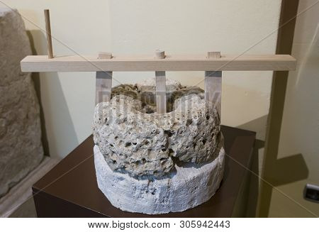 Cabra, Spain - May 19th, 2019: Roman Hand Mill With Reconstructed Handle. Archaelogical Cabra Museum