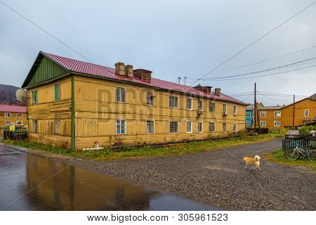 Esso, Kamchatka Peninsula, Russia- 02 October 2014: Wooden Yellow Buildings. Housing Estate In A Sma