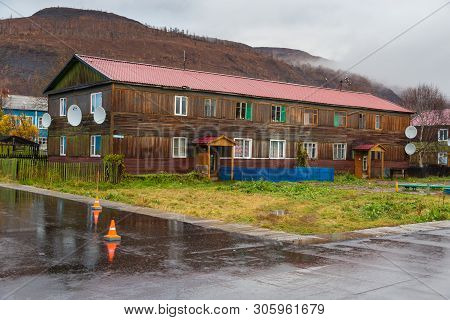 Esso, Kamchatka Peninsula, Russia- 02 October 2014: Wooden Block Of Flats. Housing Estate In A Small