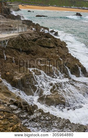 raging and furious sea breaking against the rocks, Cantabrian Sea in the North of Spain