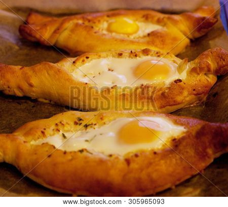 Adjar khachapuri during cooking, close up