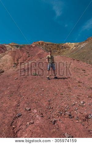 Man in Valley of Mars landscapes in the Altai Mountains,