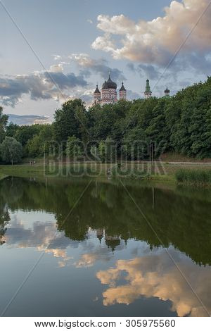 Domes Of The Monastery Are Reflected In The Lake Of Theophany Park. Kiev, Ukraine