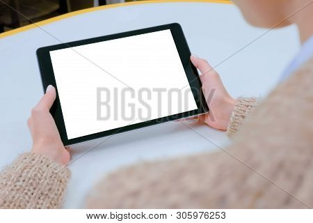Mockup Image: Over Shoulder Close Up View Of Woman Looking At Modern Digital Tablet Computer Device 
