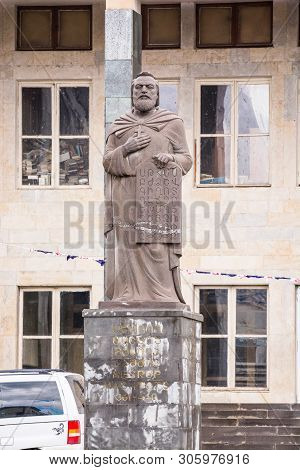 Akhalkalaki, Georgia - May 9, 2017. Statue On Main Square In Front Of Library