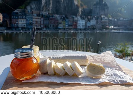 Belgian Abbey Cheese Fagotin In Pieces With Jam Served Outdoor With View On Maas River And Center Of