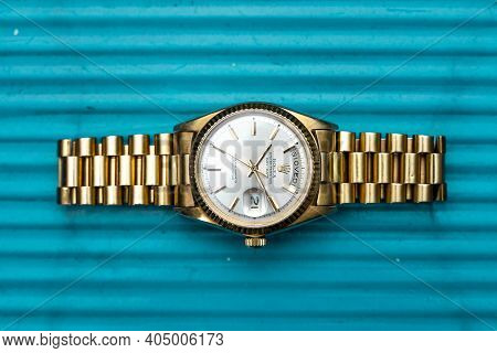 Rolex Oyster Perpetual Day- Date Watch On Metal Background