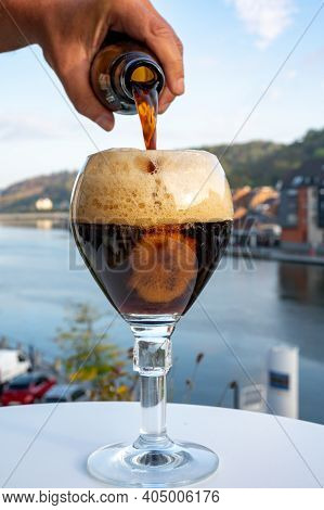 Pouring Of Strong Belgian Abbey Beer And Tasting Of Cheeses Made With Trappist Beer And Fine Herbs W