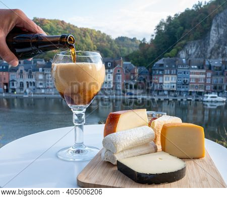 Pouring Of Belgian Abbey Beer And Tasting Of Cheeses Made With Trappist Beer And Fine Herbs With Vie