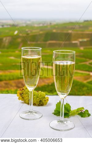 Tasting Of French Sparkling White Wine With Bubbles Champagne On Outdoor Terrace With View On Green 