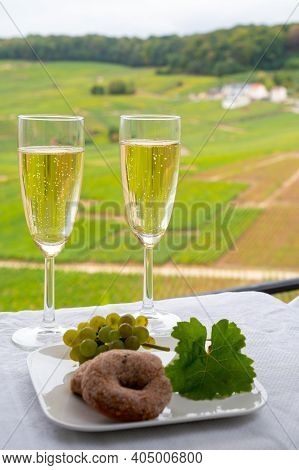 Tasting Of French Sparkling White Wine With Bubbles Champagne On Outdoor Terrace With View On Green 