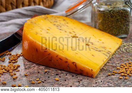 Cheese Collection, Piece Of Hard Yellow Dutch Gouda Cheese With Dried Caraway Or Cumin Seeds Close U