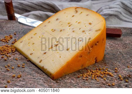 Cheese Collection, Piece Of Hard Yellow Dutch Gouda Cheese With Dried Fenugreek Seeds