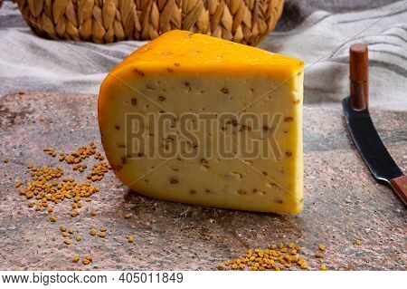 Cheese Collection, Piece Of Hard Yellow Dutch Gouda Cheese With Dried Fenugreek Seeds