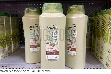 Suave Brand Conditioner Bottles On A Shelf At Walmart.