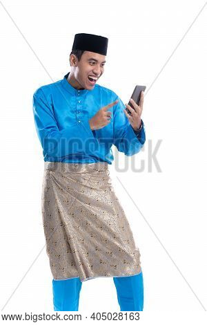 Man Excited While Looking At His Phone