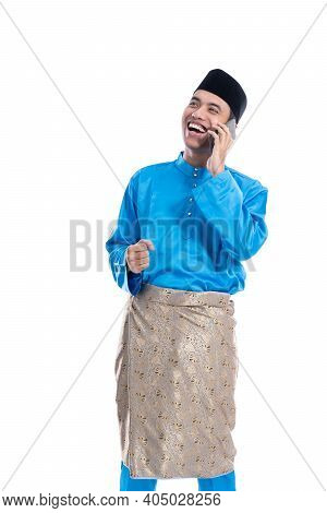 Male Muslim Talk On His Phone Over White