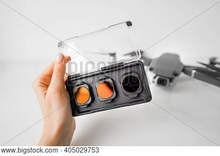Woman Hand With Nd Filters And Polarising Filters Set For Drone. Filters For The Drone Camera.
