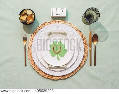 Beautiful Festive Table Setting For St.patricks Day With Cutlery And Lucky Symbols. Top View Of Sain