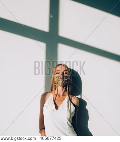Pandemic Fashion. Ethnic Style. Female Elegance. Woman Squinty Eyes Wearing Classic Dress Designer G