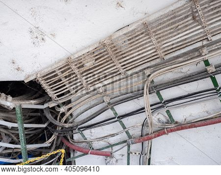 Electric Cables. The Close Up View On Lots Of Cables At A Wall In A Subway Tunnel