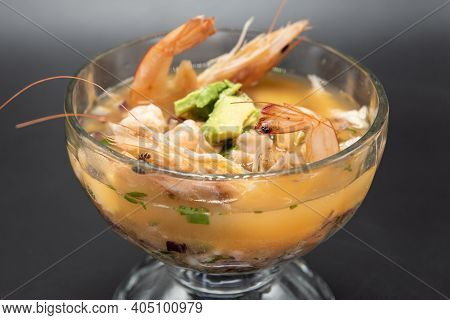 Goblet Of Warm Shrimp Broth With Head And Tail Included In Soup.