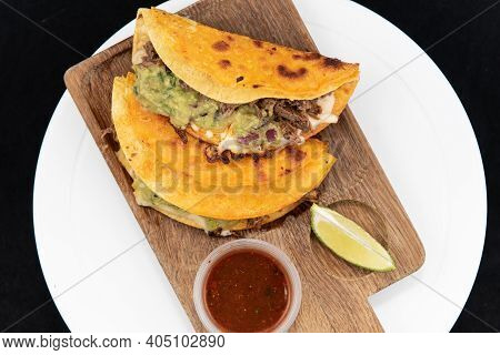 Overhead View Of Mexican Culinary Favorite Shrimp Quesatacos Served On A Wooden Cutting Board And A 