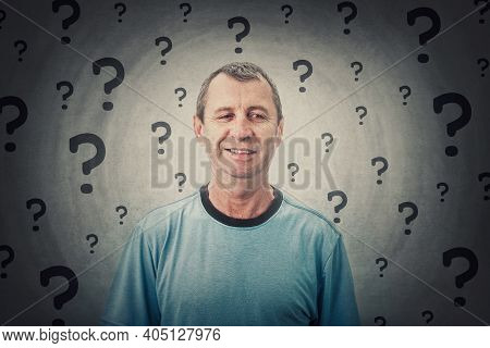 Portrait Of Thoughtful Middle Age Man Looking Suspicious Aside With A Distrust Smile. Puzzled And Do