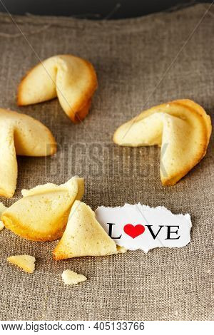 Cookies Shaped Like Tortellini With The Word Love Written On A Paper.vertical Image.